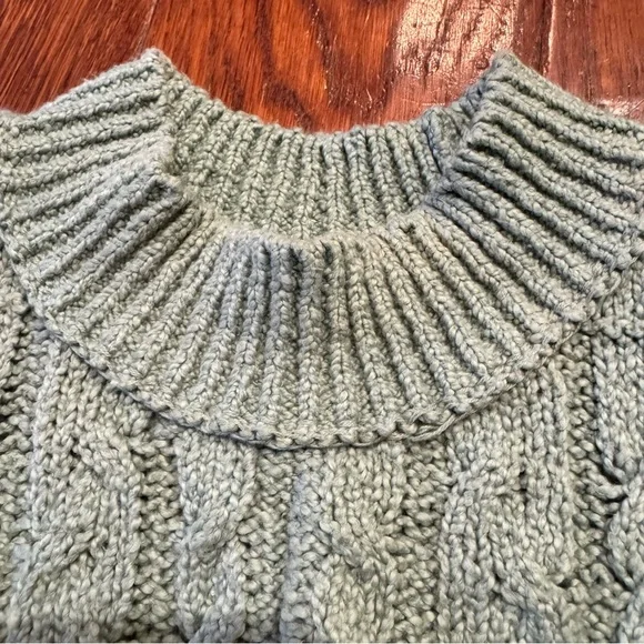 Free People Cropped Cable Knit Sleeveless Turtleneck Sweater in Mountain Mint - Picture 4 of 9